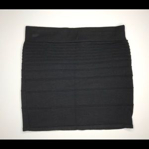Black ribbed fitted knit skirt.